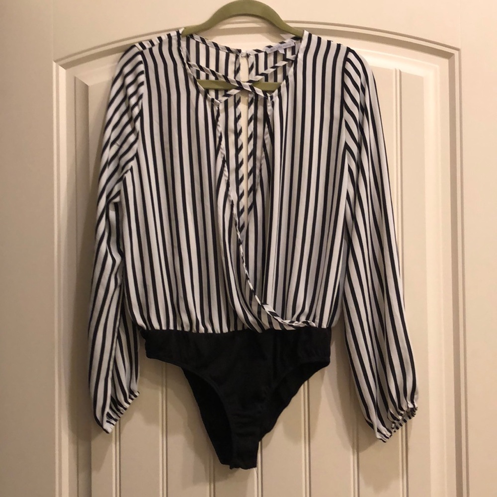 Black and white stripped, long sleeve, body suit.